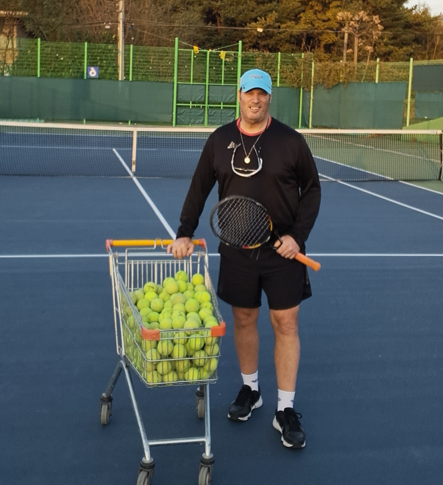 Mark Dake coaching on the tennis court
